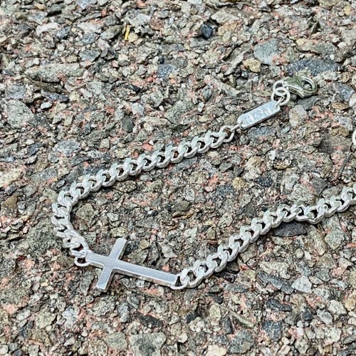 Sterling silver cross bracelet can be customized with name
