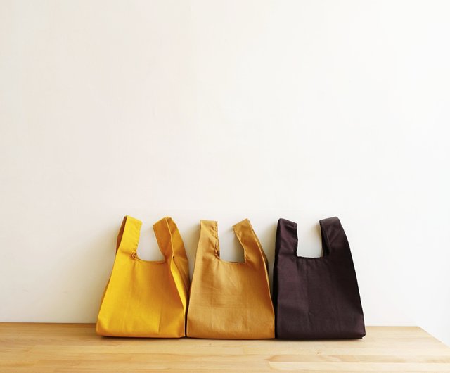 Place fall leaves in eco-friendly paper bags for collection by