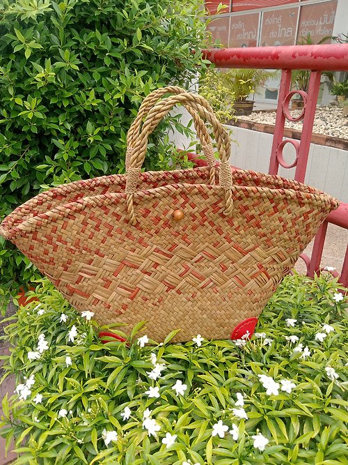 bangkokcrafter Krajood bag in the shape of a fan The bag has been coloured crimson.
