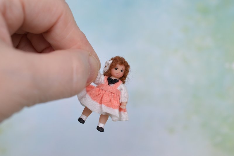 Miniature  toy doll in 24th scales.