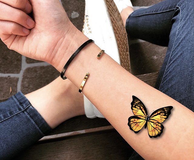 yellow butterfly tattoo