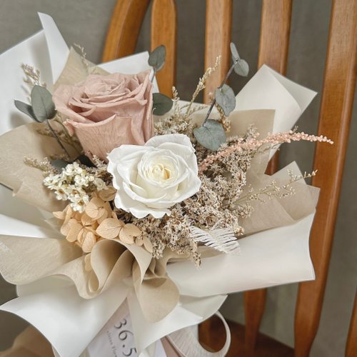 Bouquet of eternal roses in pale tones