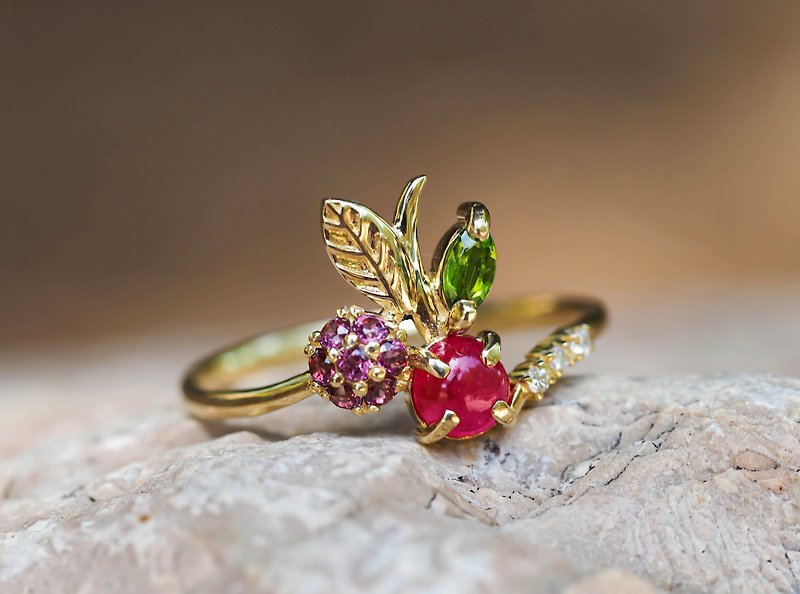 14k  gold ring with ruby, rose sapphires, tourmaline and diamonds.