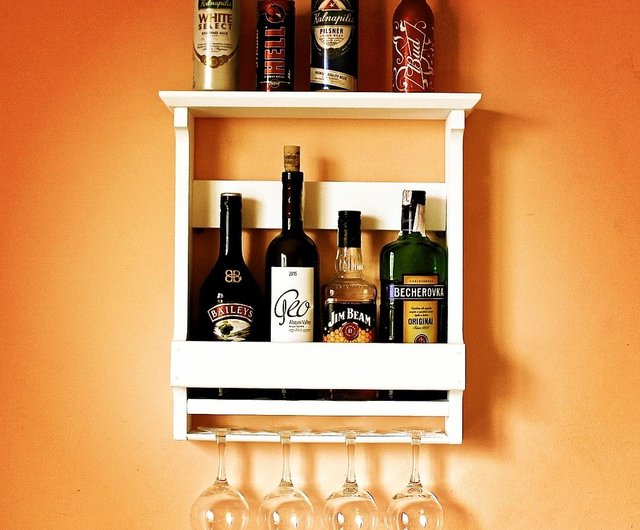 Rustic whisky bottles rack with glass holder. Wooden bottles shelf