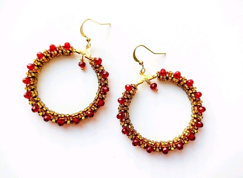 Hoop earrings with red faceted beads