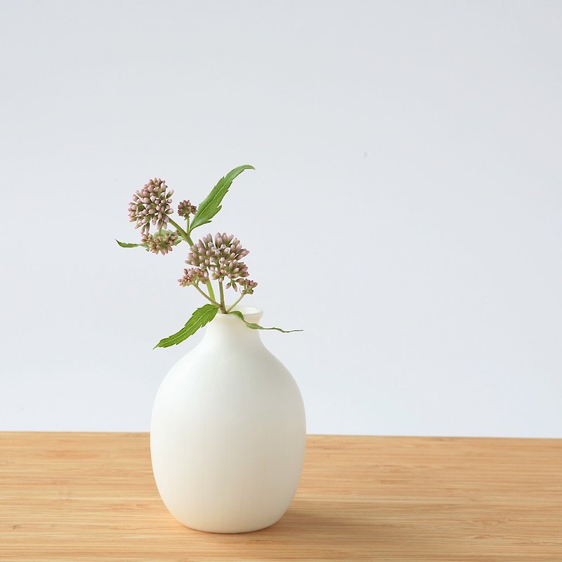 Small white pottery flower vase