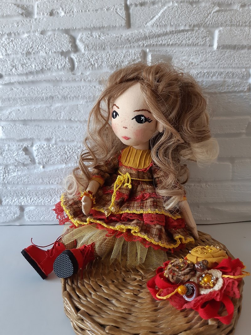 Interior textile art doll with an embroidered face