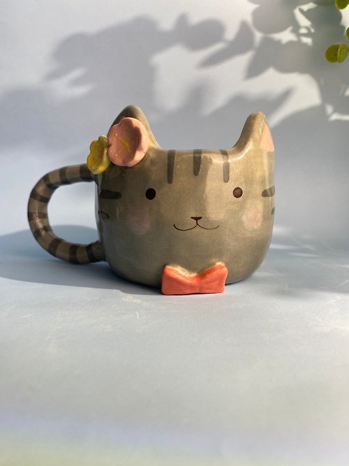 cher’s pottery Handmade ceramic cup. Handmade ceramic mug with cute cat and flower lover.