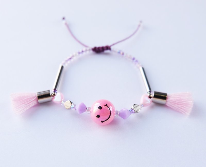 Smiley pink tassel string bracelet - สร้อยข้อมือ - วัสดุอื่นๆ สึชมพู