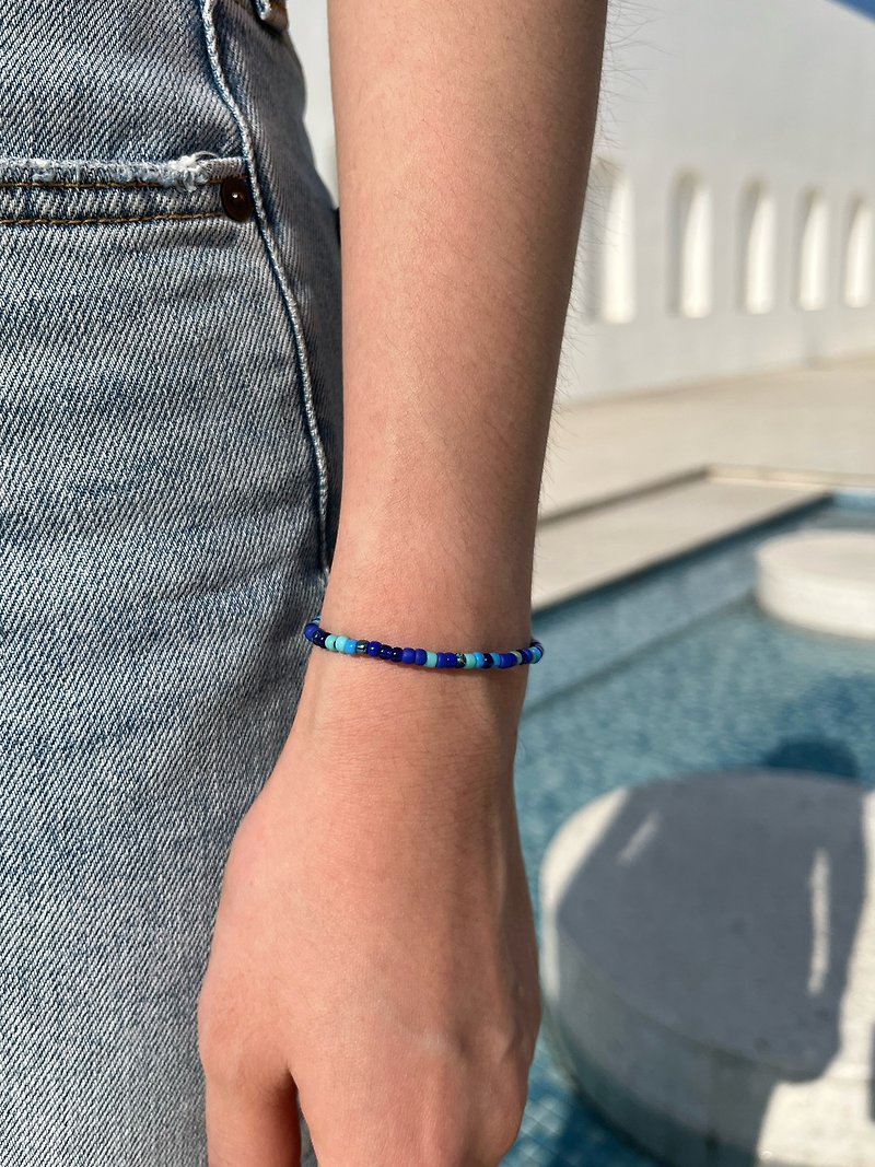 Original life by the sea Japanese blue mixed beaded braided bracelet limited new product - สร้อยข้อมือ - วัสดุอื่นๆ สีน้ำเงิน