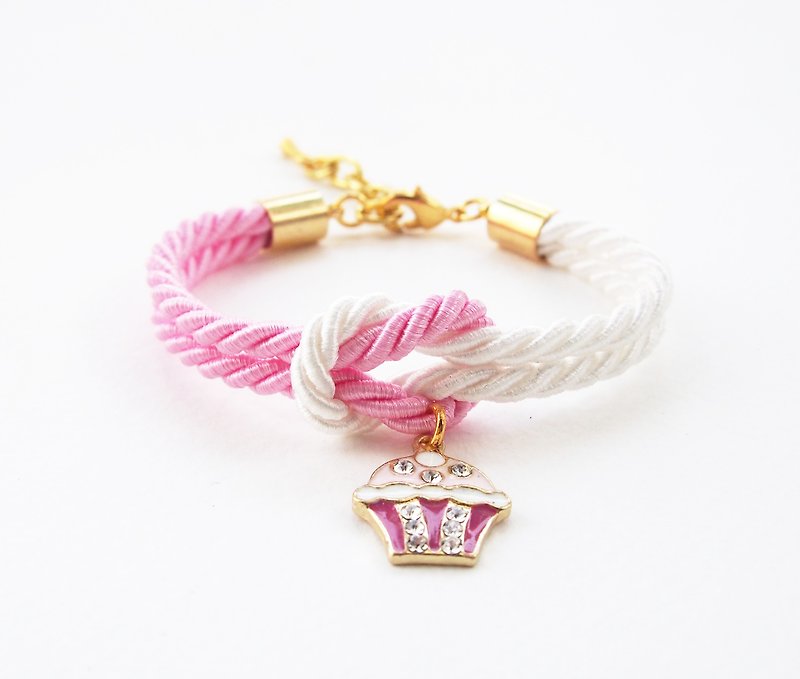 Pink and white knot bracelet with cupcake charm - สร้อยข้อมือ - วัสดุอื่นๆ สึชมพู
