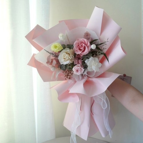 Premium Photo  Beautiful delicate pink flower bouquet of white roses and  eustoma in a beautiful package