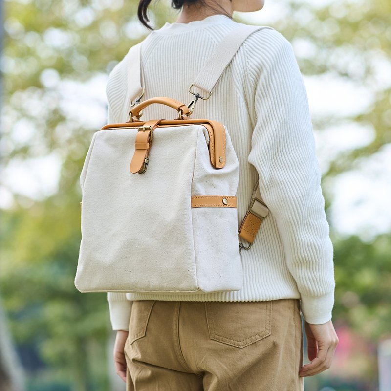 [Canvas meets leather] Golden backpack retro stitching casual backpack leather canvas bag simple and fashionable - กระเป๋าแมสเซนเจอร์ - หนังแท้ ขาว