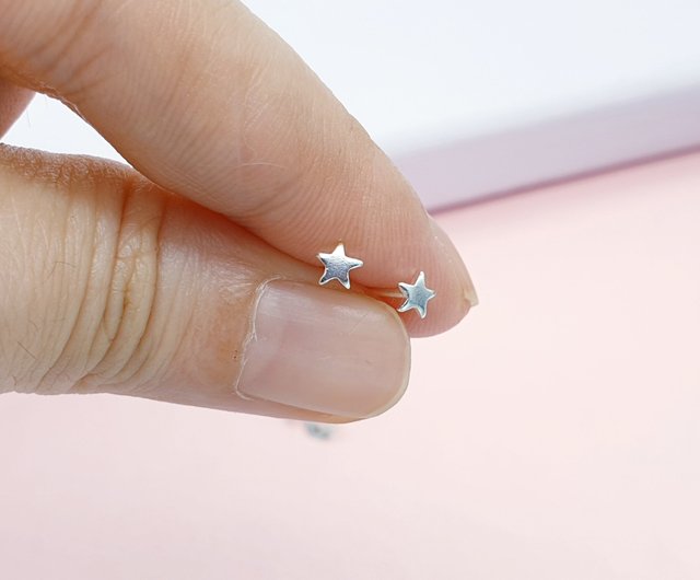 Tiny star stud on sale earrings