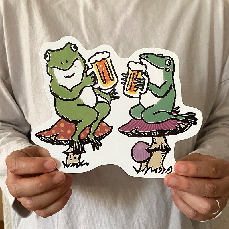 Deformed postcard frog toasts with beer