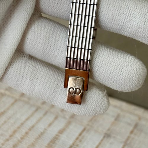 Christian Dior gold round dial silver geometric strap