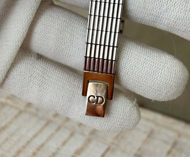Christian Dior gold round dial silver geometric strap