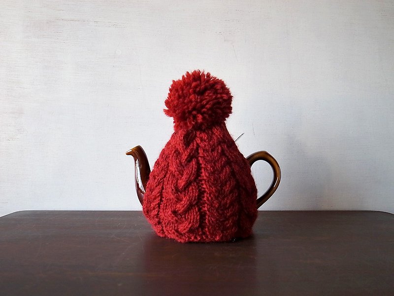 tea-cosy red tea-cosy with cable pom-poms