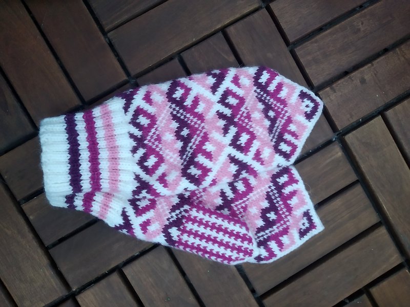 Women&#x27;s hand-knitted wool mittens are very warm with a pattern
