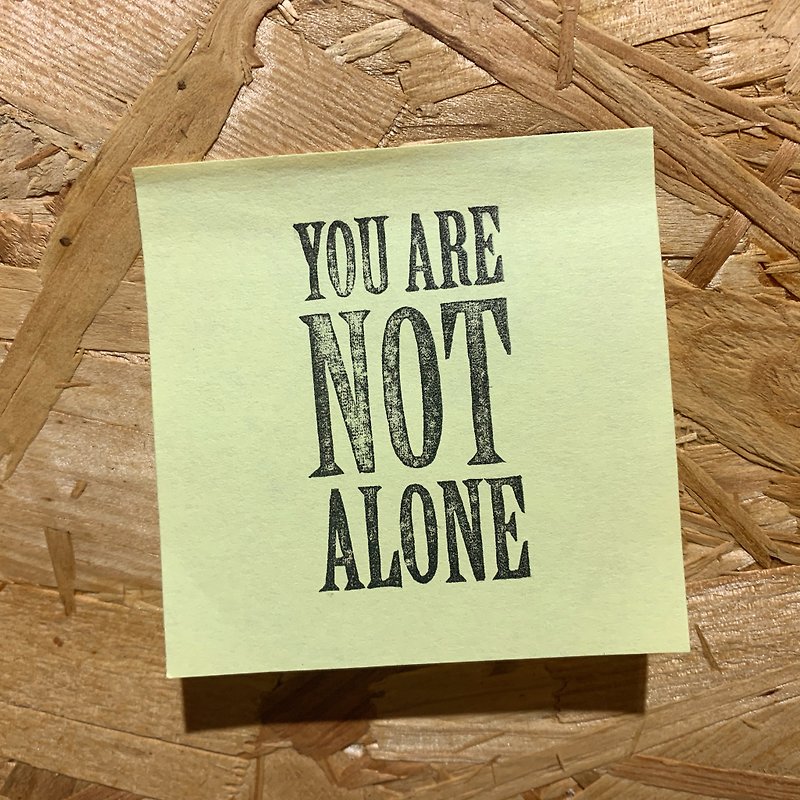 &quot;You are not alone&quot; handmade rubber stamp