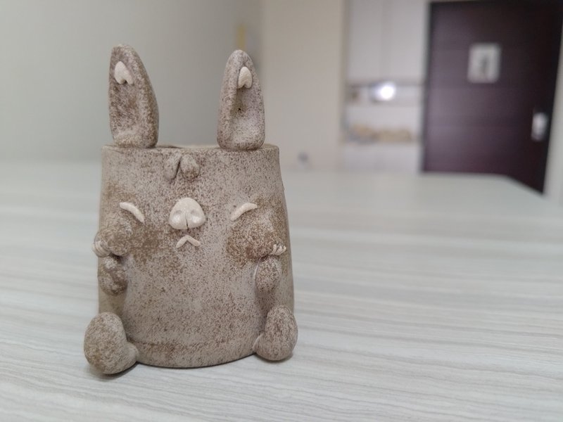 Rabbit holding his cheek - Items for Display - Pottery Gray