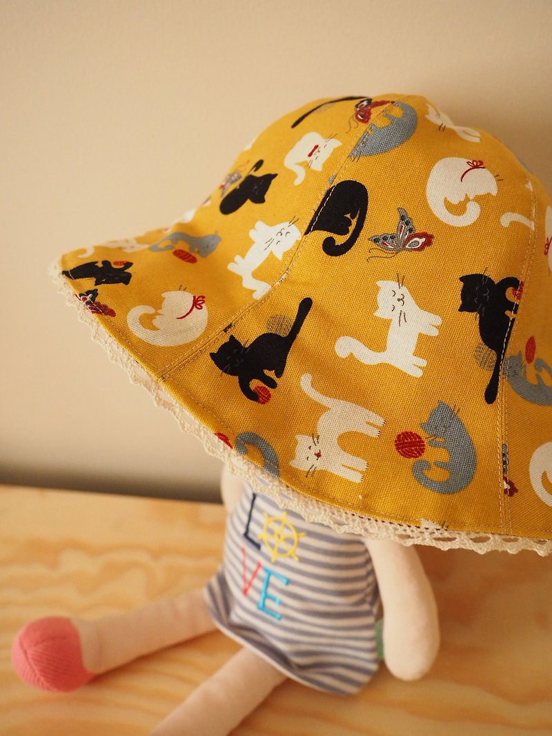 Handmade reversible sun protection hat Cat with floral pattern