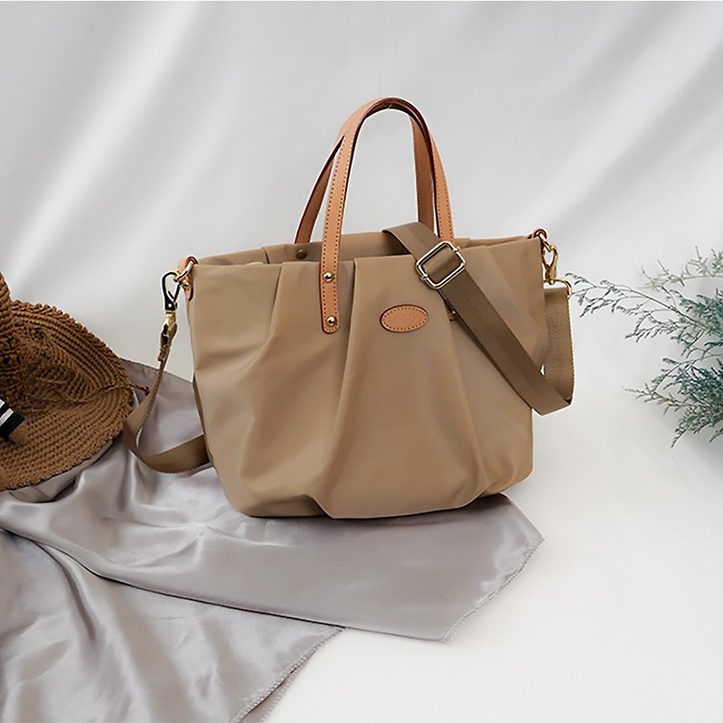 Casual light wrinkle pumpkin bag portable cross-back dual-use bag (milk tea color) - กระเป๋าแมสเซนเจอร์ - ไนลอน 