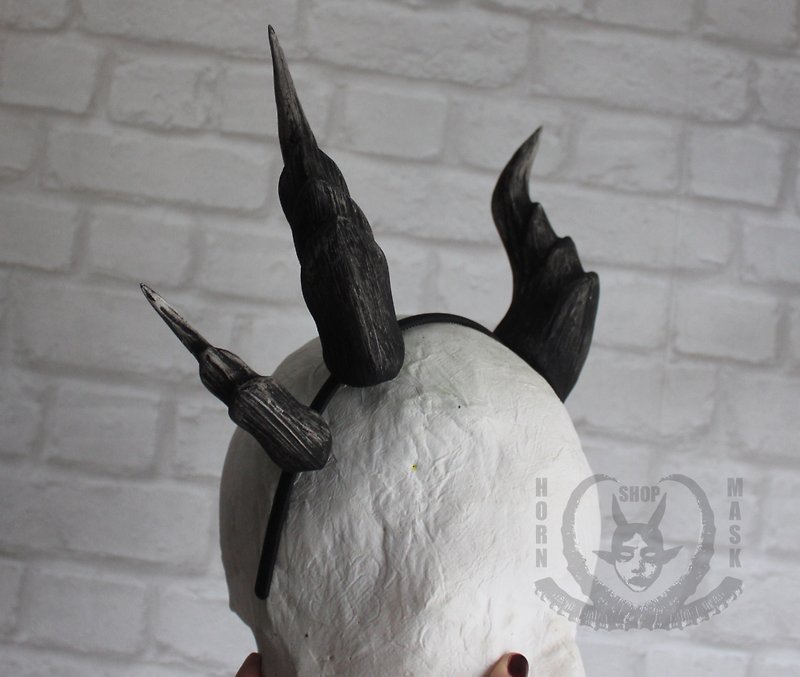 Double black dragon horns on the headband. Original design.