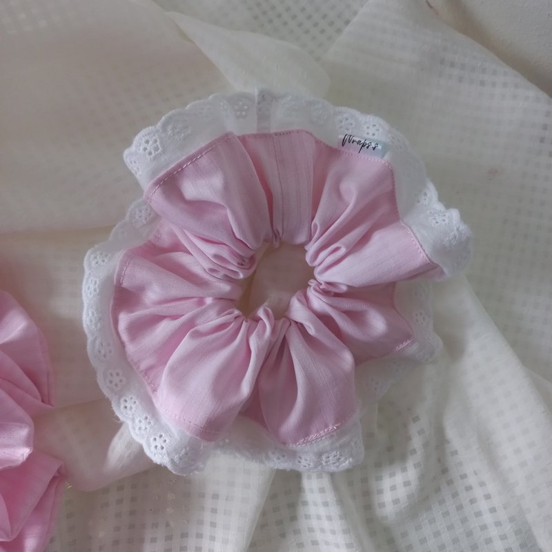 Handmade Scrunchies in soft pink. The fabric features a subtle striped pattern with a delicate white ruffled edge. - Hair Accessories - Cotton & Hemp Pink