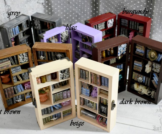 A miniature library decorating the bookshelves in the living room
