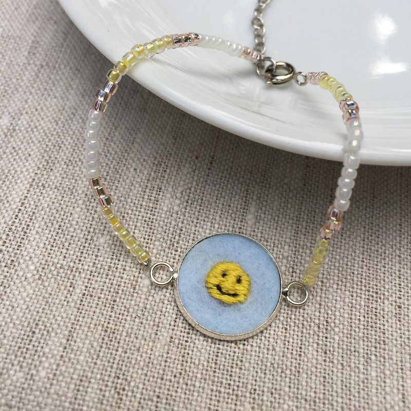 beads bracelet with SMILEY hand embroidery pendant - Bracelets - Plastic Yellow