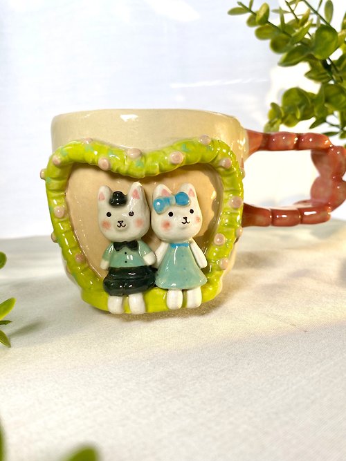 cher’s pottery Handmade ceramic mug with a cute white cat pattern.