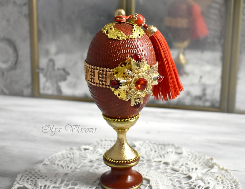 Red figurine-egg on a curly stand collectible statuette egg