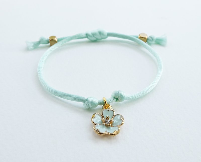 Mint silk rope bracelet with sakura charm - Bracelets - Other Materials Blue