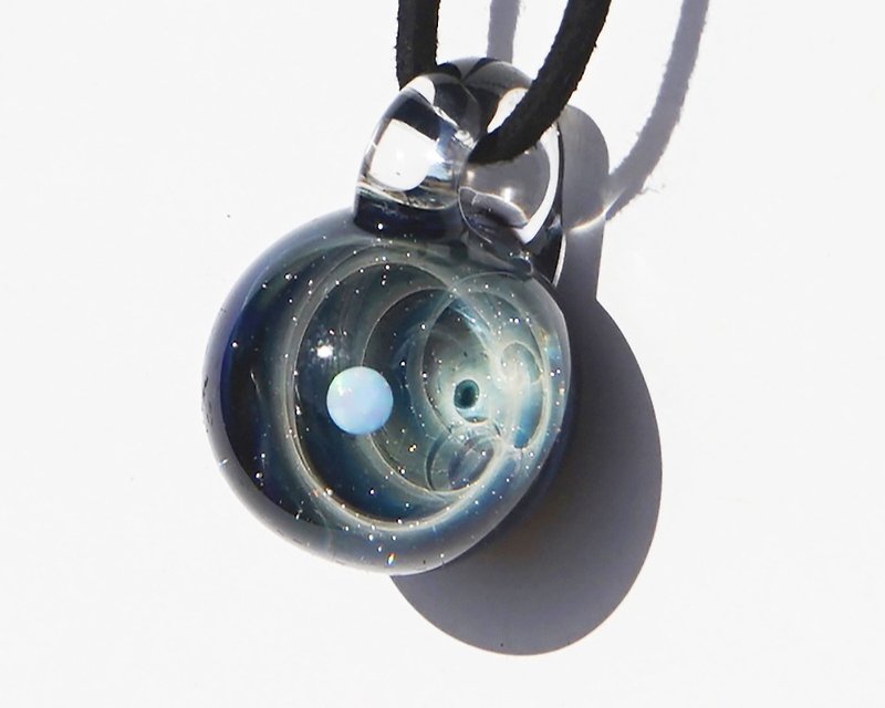 Your first star only. Ver spiral glass pendant with white opal universe