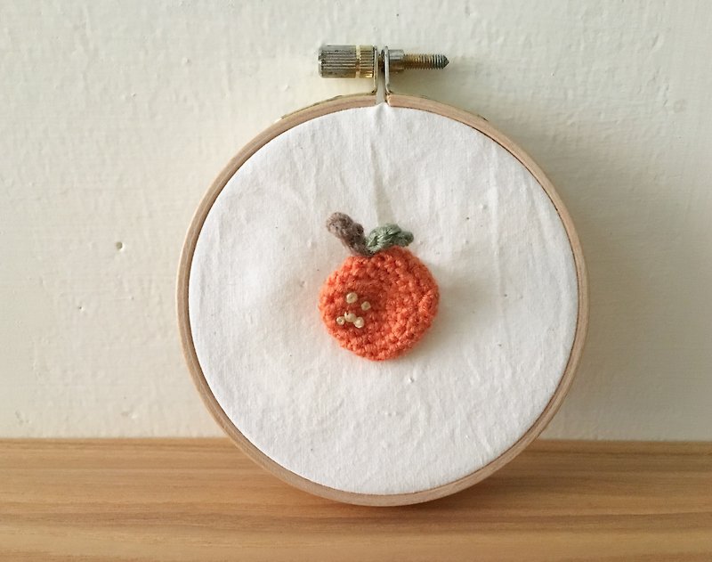 Crocheted vegetable and fruit brooch orange