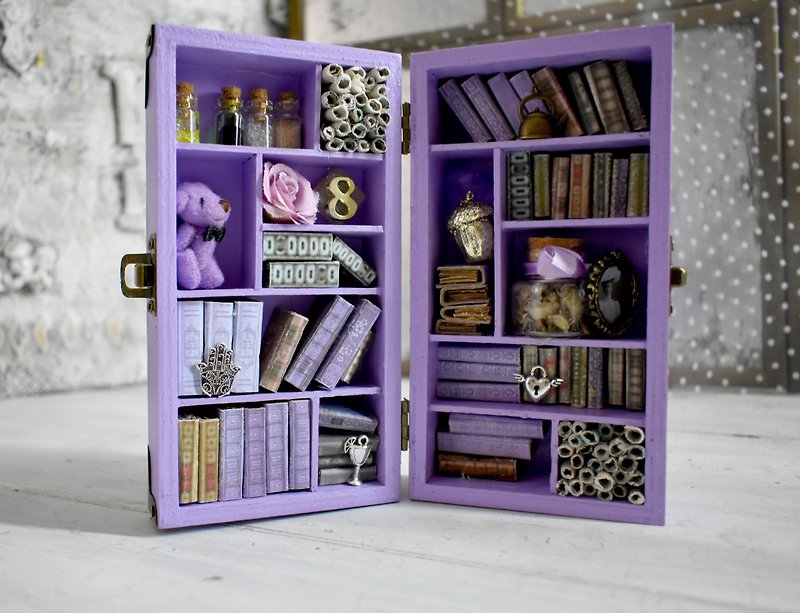 A miniature library decorating the bookshelves in the living room