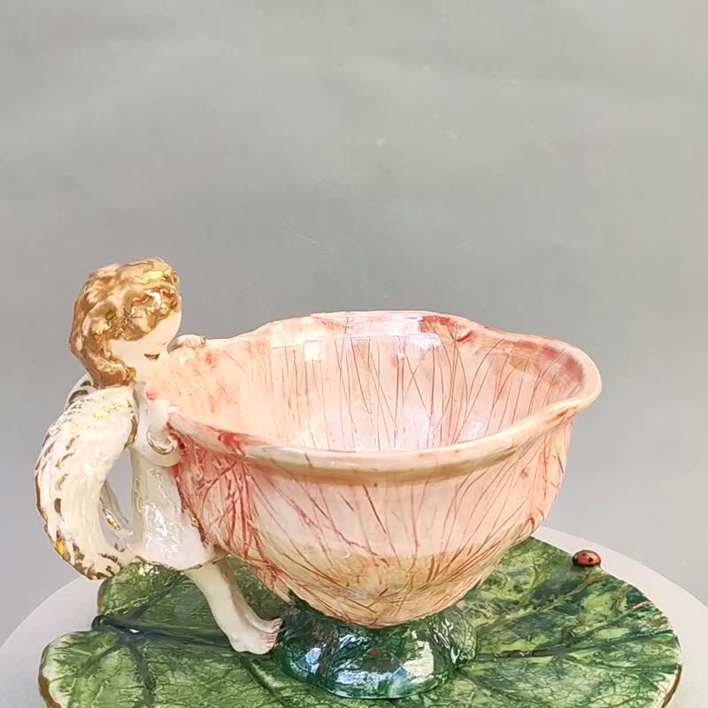 Beautiful Cup and saucer set Baby angel figurine.Flower shaped cup leaf saucer